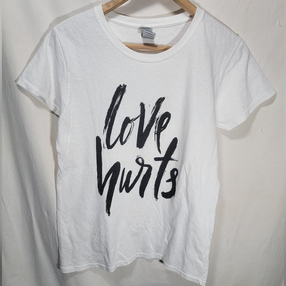 Women's size medium white t-shirt "Love Hurts" printed in hand writing style
